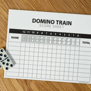 Domino Train Game Score Sheet on wooden table with dominoes